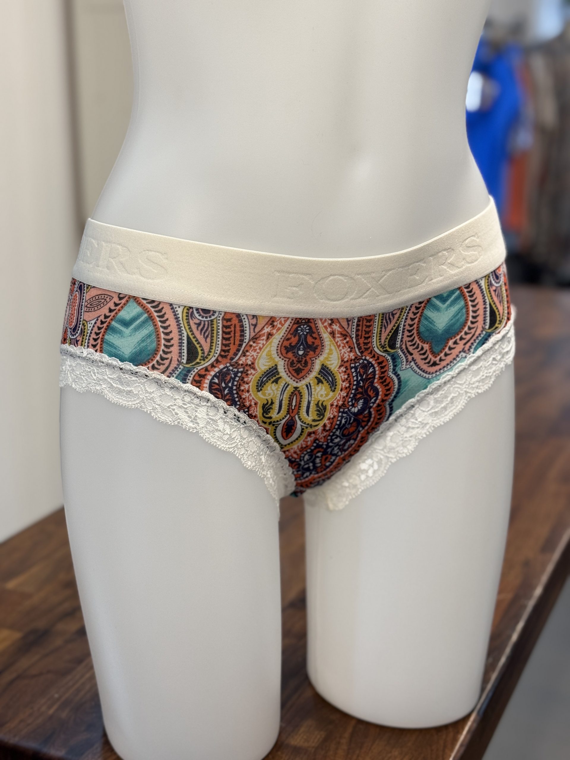 Ivory Logoband over Green Paisley